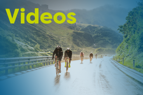 Descent featuring many cyclists in the shape of the Arlberg Giro logo with the text ‘Videos’ in yellow.