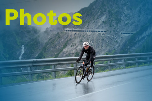 Image of a cyclist with a blue overlay and the text ‘Photos’ in yellow.